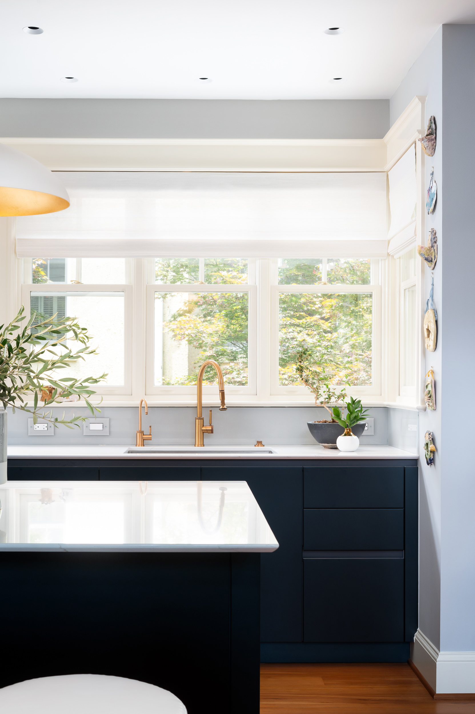 Kitchen view toward sink and windows